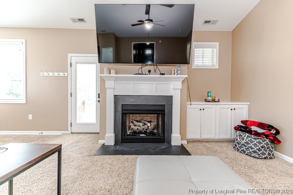 463 Juno Drive Broadway, NC 27505 - Photo 7 of 30 a living room with furniture and a fireplace