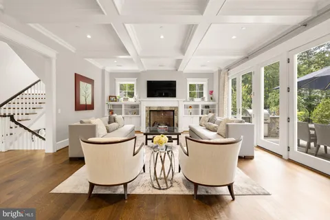 a living room with furniture fireplace and a flat screen tv