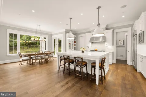 a kitchen with stainless steel appliances granite countertop a stove and a microwave