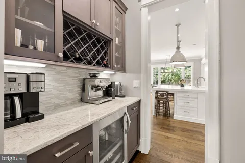 a patio with a table and chairs under an umbrella