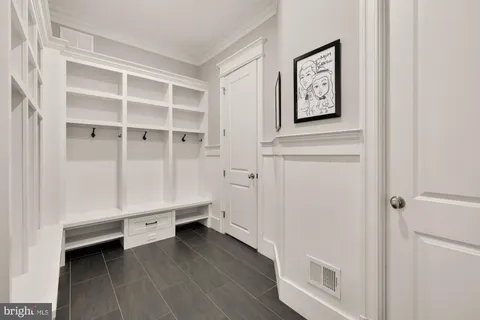 a large spacious bathroom with a large tub shower and windows