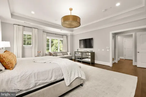 a spacious bathroom with a granite countertop sink and a mirror