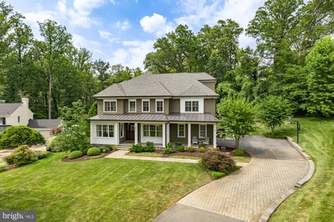 a front view of a house with a yard table and chairs