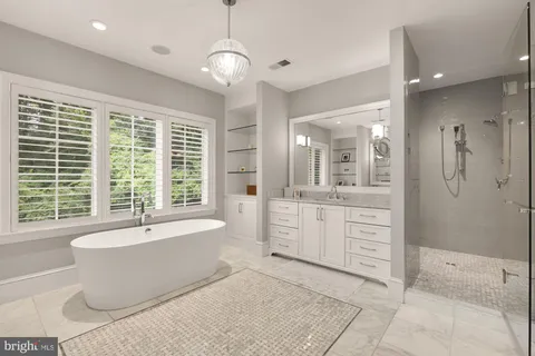 a view of a workspace with furniture and a book shelf