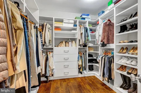 a view of a livingroom with furniture and a window