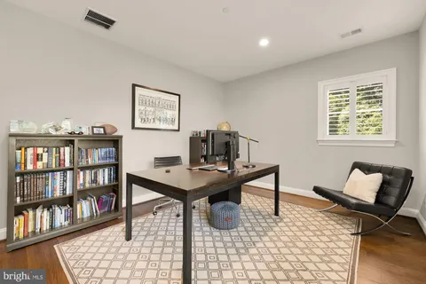 a room with furniture and wooden floor