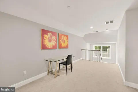 a kitchen with kitchen island a sink stainless steel appliances and cabinets