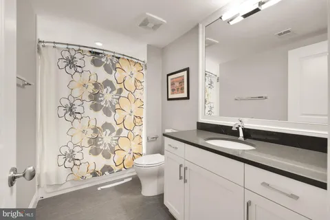 a front view of a house with a yard table and chairs