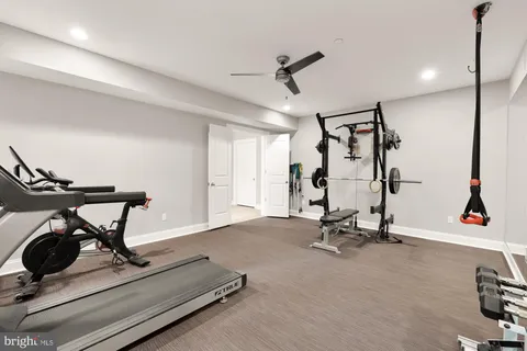 a yellow house with trees in front of it