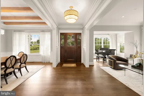 a living room with furniture fireplace and window