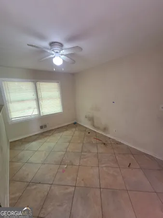 a view of an empty room with a window