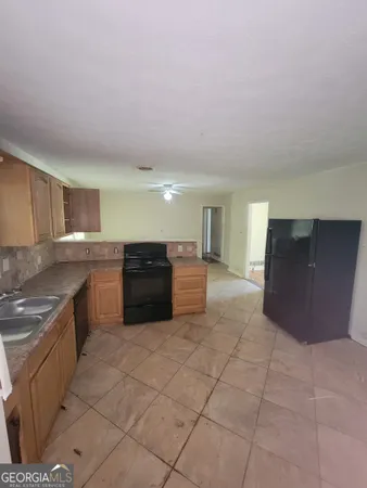 a large kitchen with a cabinets and counter space