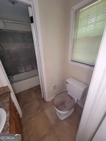 a bathroom with a toilet and a sink