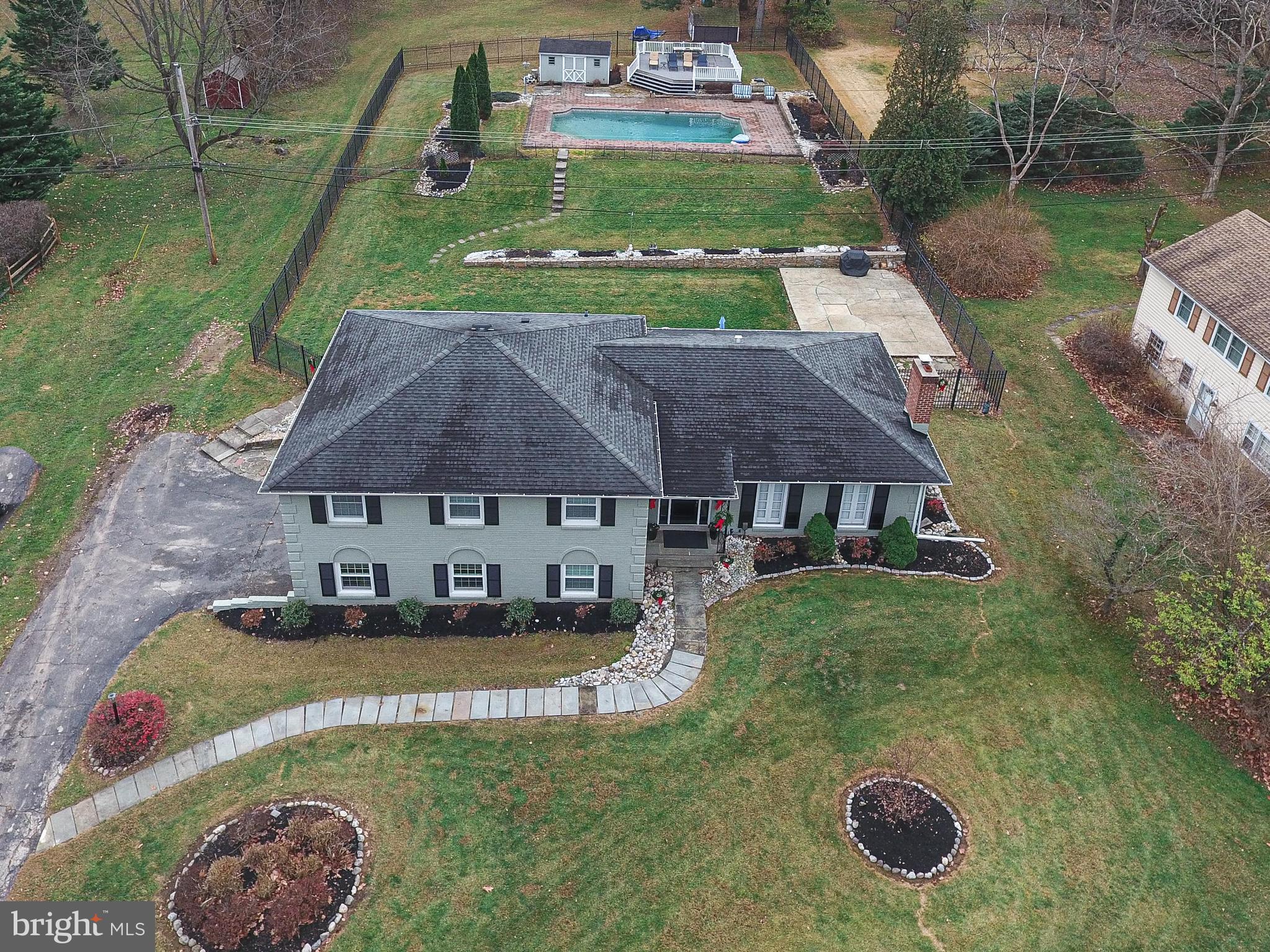a aerial view of a house with yard