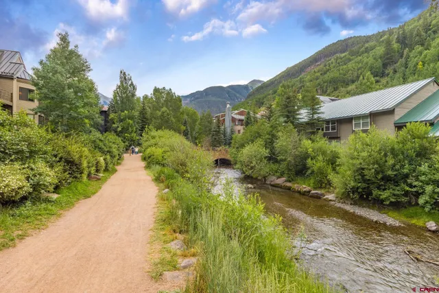 a view of a chairs and table in the patio