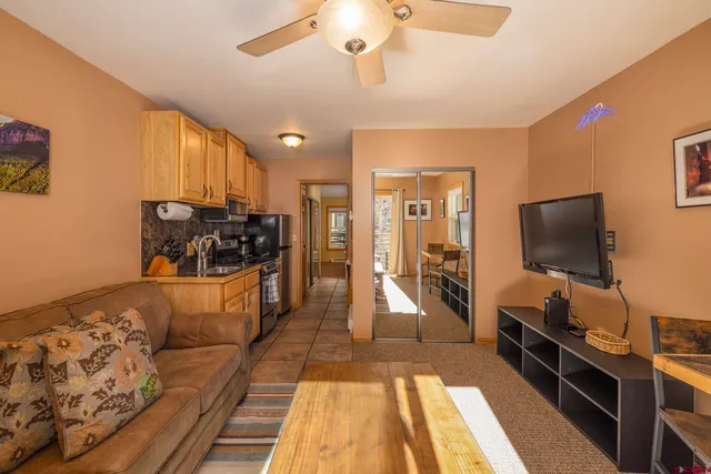 a kitchen with granite countertop a stove and a microwave