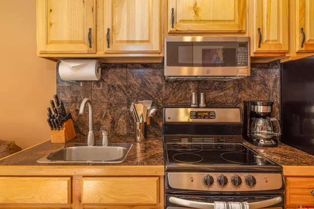 a kitchen with a stove and a microwave