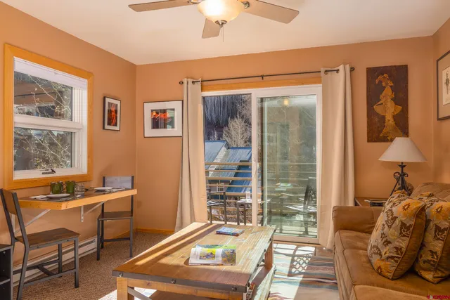 a living room with furniture and a window