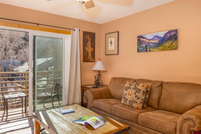 a dining room with a table and chairs