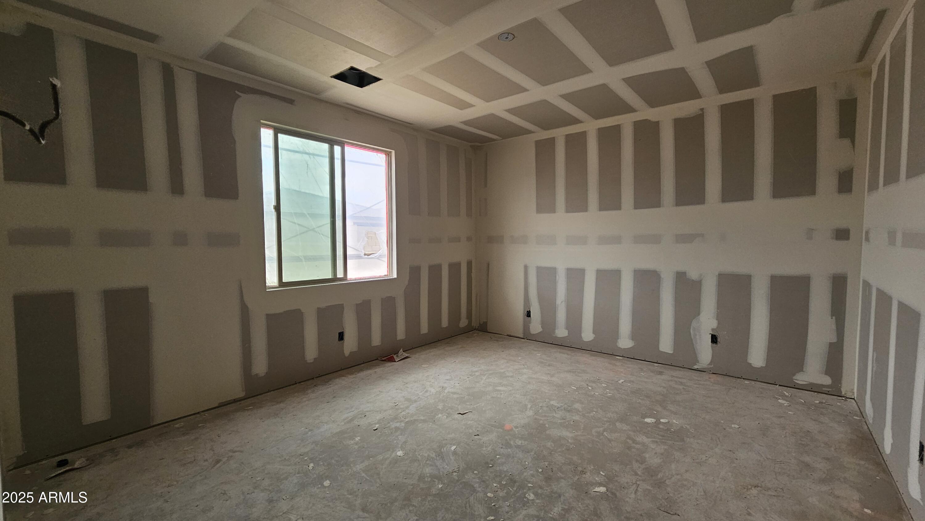 2654 Rustler Road San Tan Valley, AZ 85140 - Photo 12 of 38 a view of an empty room with windows