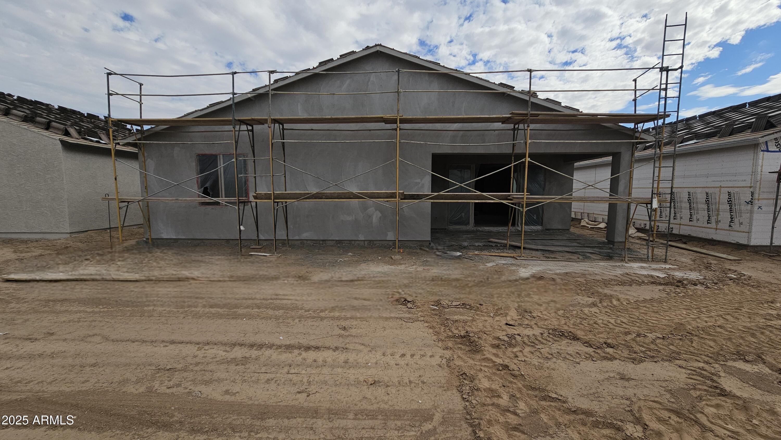 2654 Rustler Road San Tan Valley, AZ 85140 - Photo 15 of 38 a backyard of a house