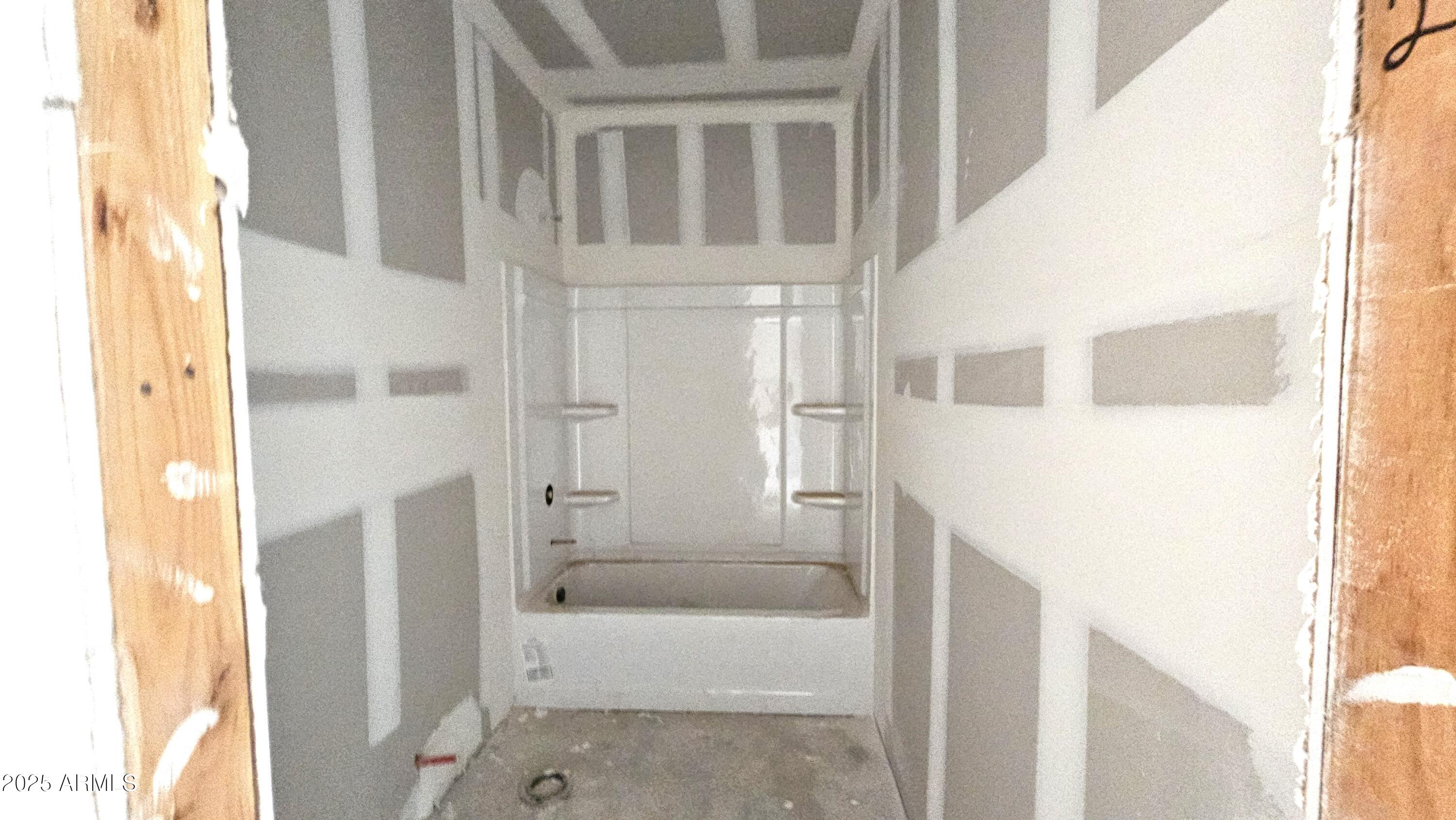 2654 Rustler Road San Tan Valley, AZ 85140 - Photo 5 of 38 a en suite bathroom with a tub shower and a sink