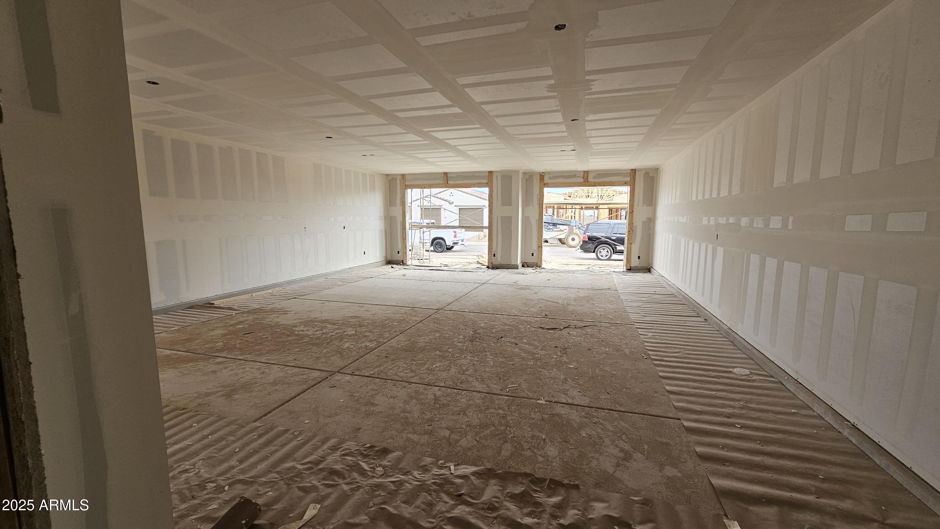 2654 Rustler Road San Tan Valley, AZ 85140 - Photo 9 of 38 a big room with wooden floor and windows