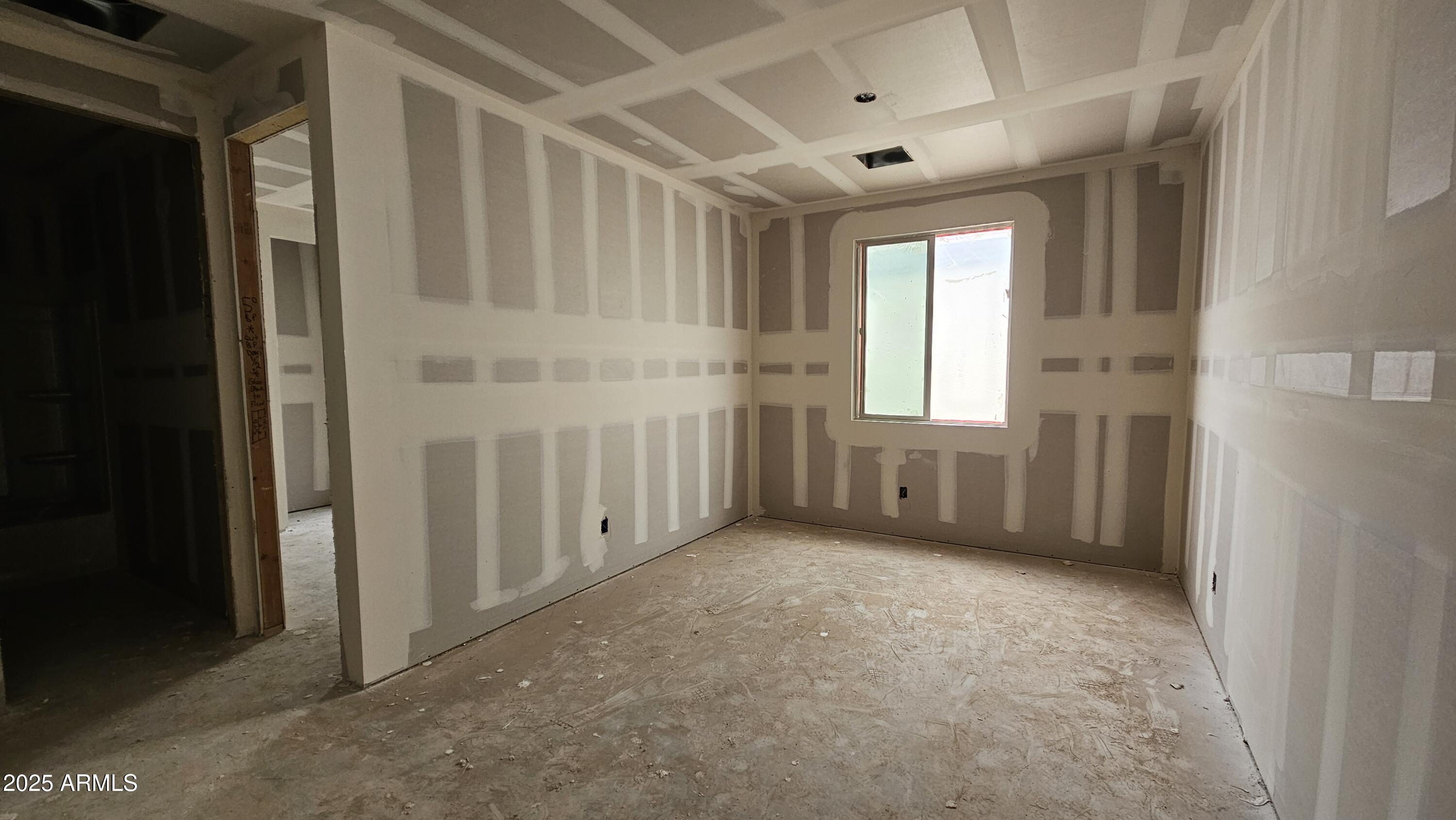 2654 Rustler Road San Tan Valley, AZ 85140 - Photo 10 of 38 a view of an empty room with a window