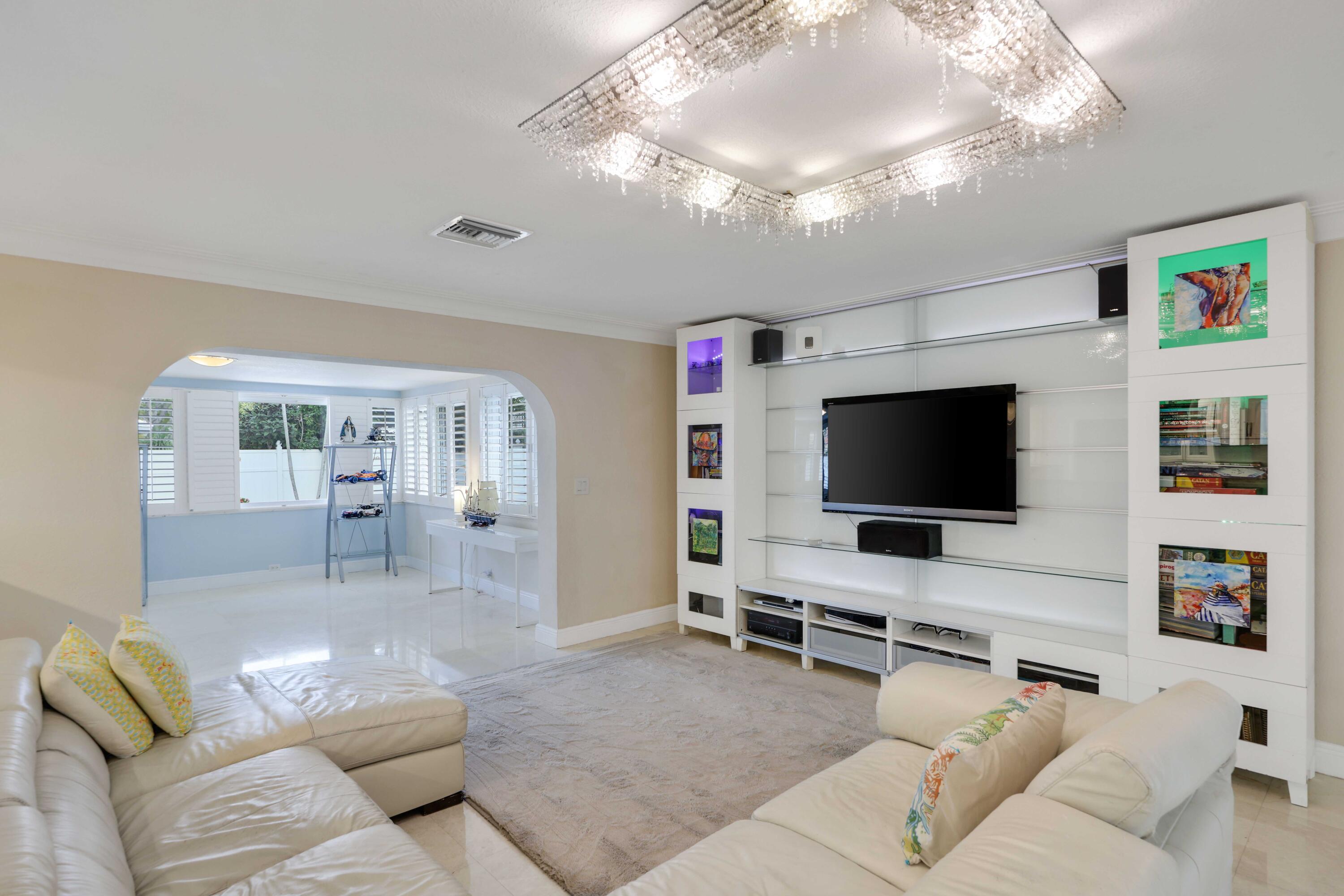 4220 Northeast 26th Terrace Lighthouse Point, FL 33064 - Photo 12 of 30 a living room with furniture and a flat screen tv