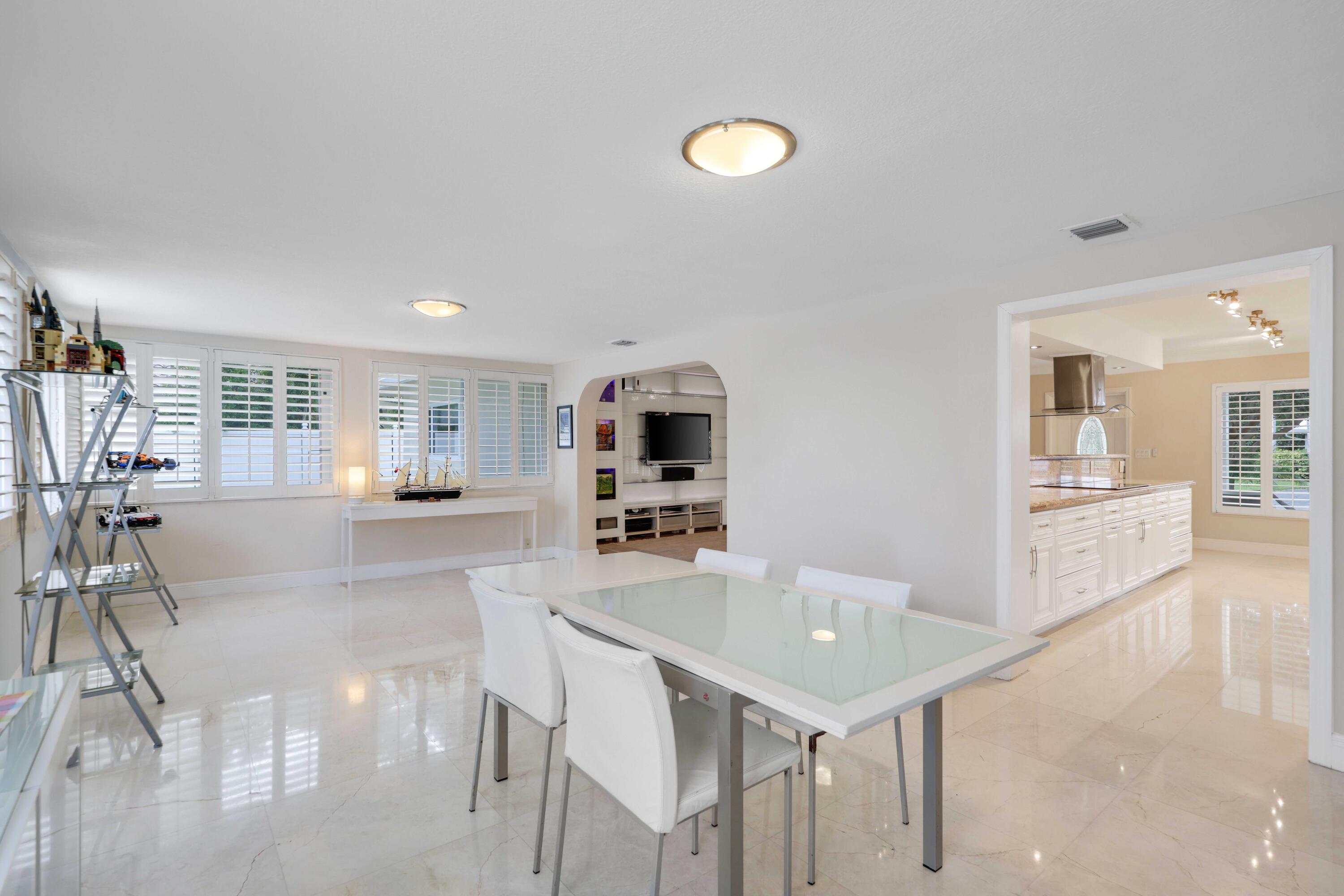 4220 Northeast 26th Terrace Lighthouse Point, FL 33064 - Photo 14 of 30 a living room with furniture and a table