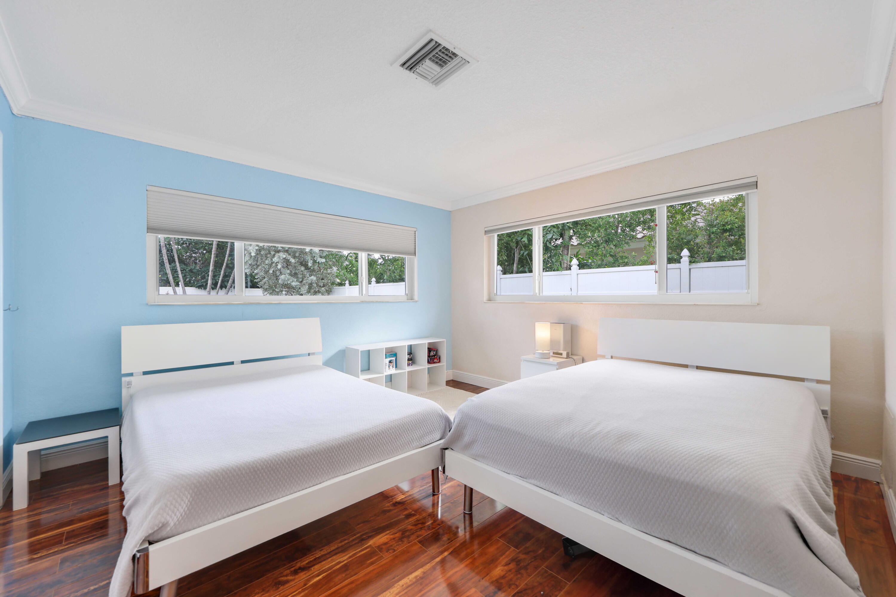 4220 Northeast 26th Terrace Lighthouse Point, FL 33064 - Photo 22 of 30 a bedroom with two beds and a window
