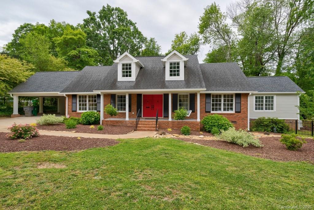 4200 Chelmsford Road Charlotte, NC 28211 - Photo 2 of 45 a front view of a house with a yard and porch