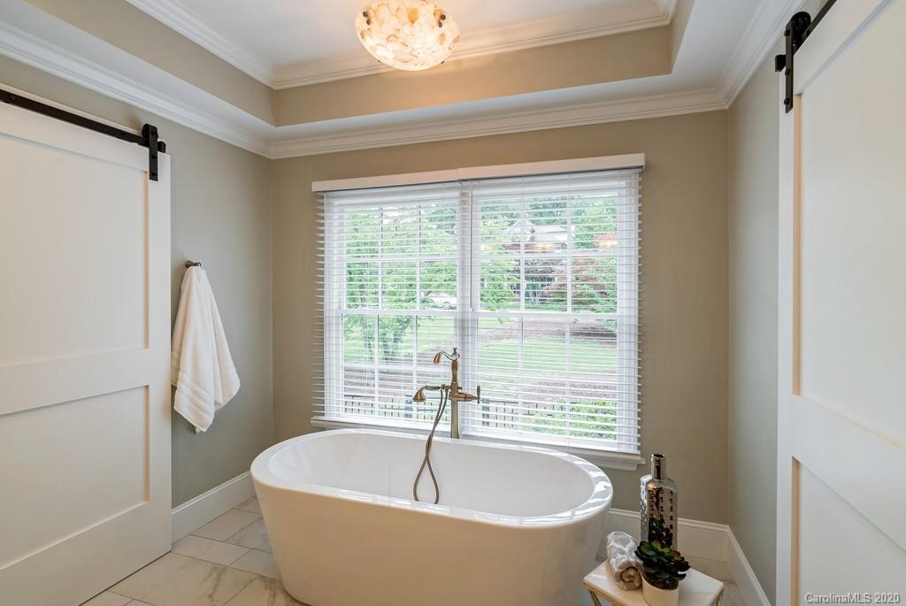 4200 Chelmsford Road Charlotte, NC 28211 - Photo 15 of 45 a spacious bathroom with a bathtub and shower