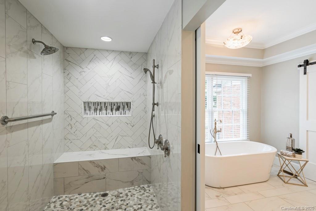 4200 Chelmsford Road Charlotte, NC 28211 - Photo 16 of 45 a bathroom with a bathtub and a shower