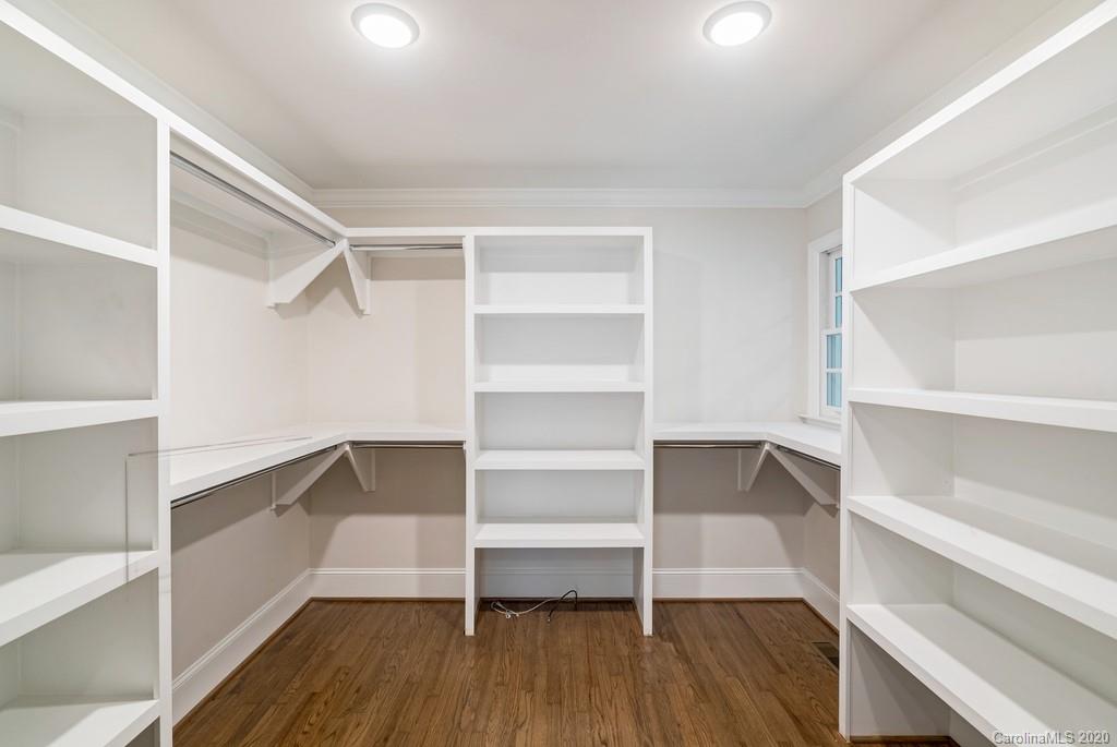 4200 Chelmsford Road Charlotte, NC 28211 - Photo 19 of 45 a view of walk in closet with empty racks