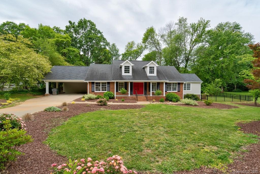 4200 Chelmsford Road Charlotte, NC 28211 - Photo 3 of 45 a front view of a house with yard patio and green space
