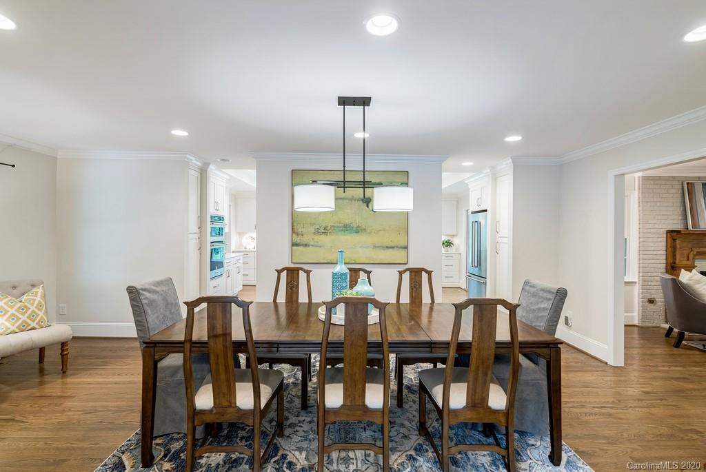 4200 Chelmsford Road Charlotte, NC 28211 - Photo 22 of 45 a view of a dining room with furniture window and wooden floor