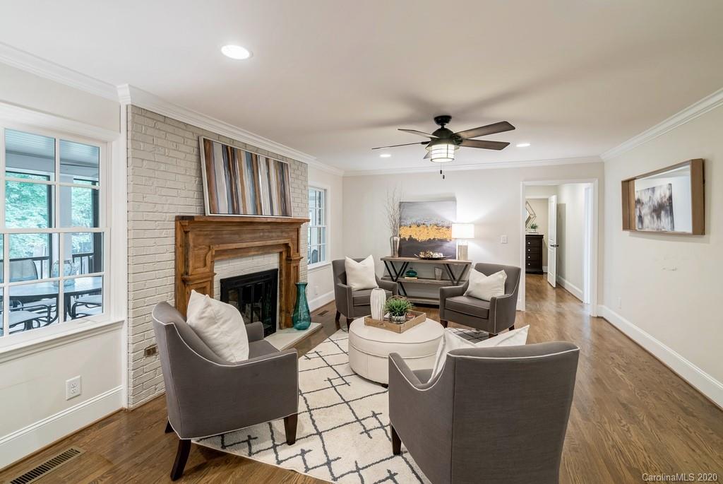 4200 Chelmsford Road Charlotte, NC 28211 - Photo 25 of 45 a living room with furniture and a fireplace