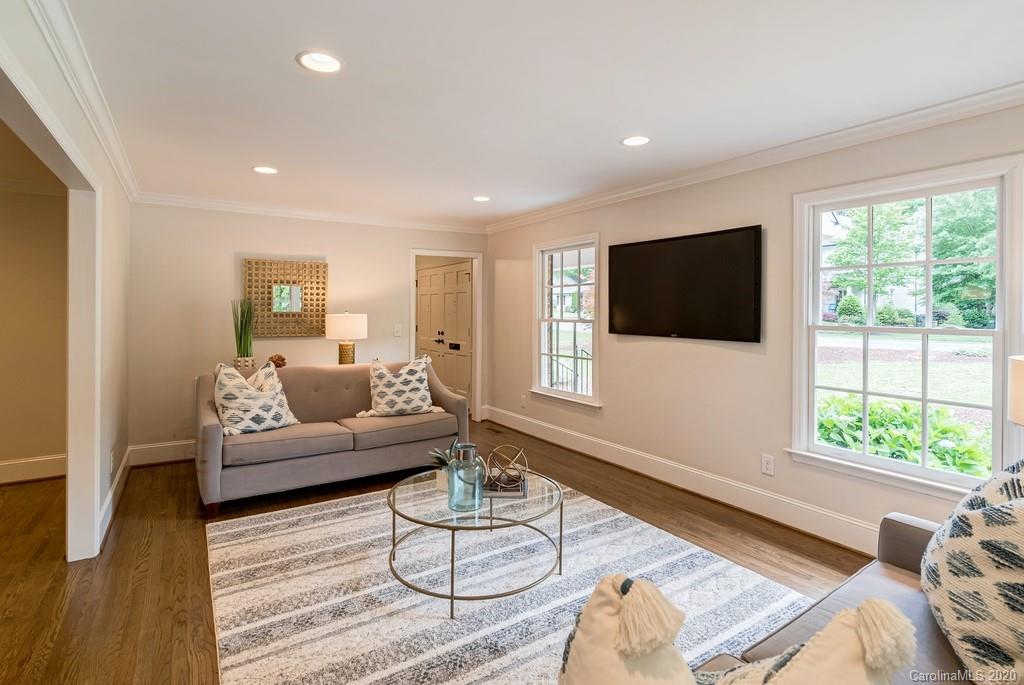 4200 Chelmsford Road Charlotte, NC 28211 - Photo 28 of 45 a living room with furniture a flat screen tv and a large window