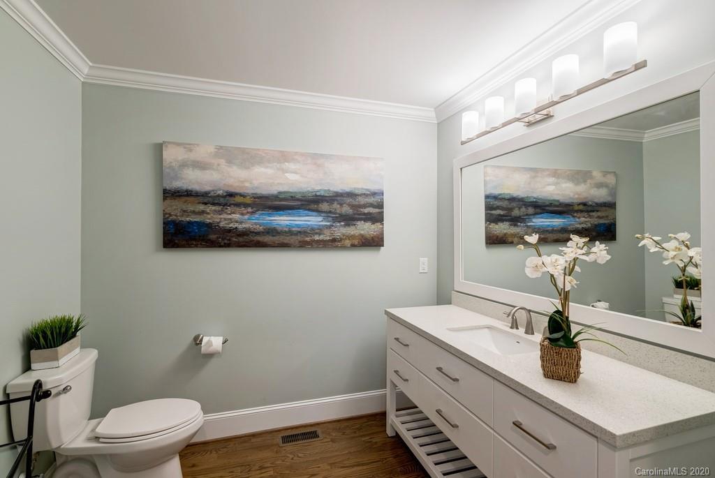 4200 Chelmsford Road Charlotte, NC 28211 - Photo 33 of 45 a bathroom with a sink mirror and toilet