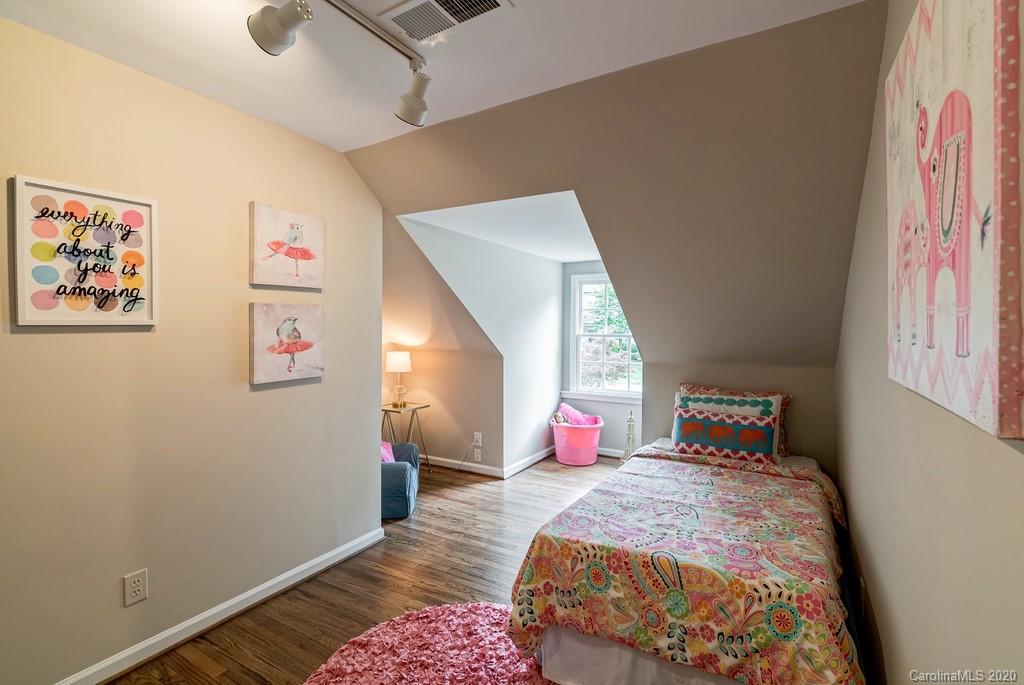 4200 Chelmsford Road Charlotte, NC 28211 - Photo 35 of 45 a bedroom with a bed and a window