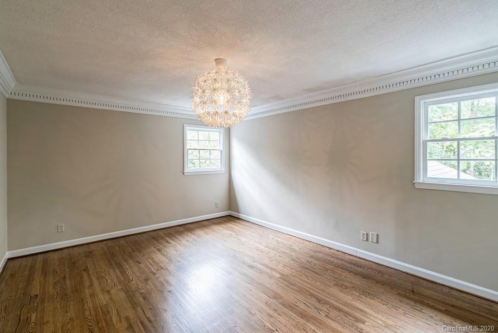 4200 Chelmsford Road Charlotte, NC 28211 - Photo 37 of 45 a view of empty room with wooden floor and window