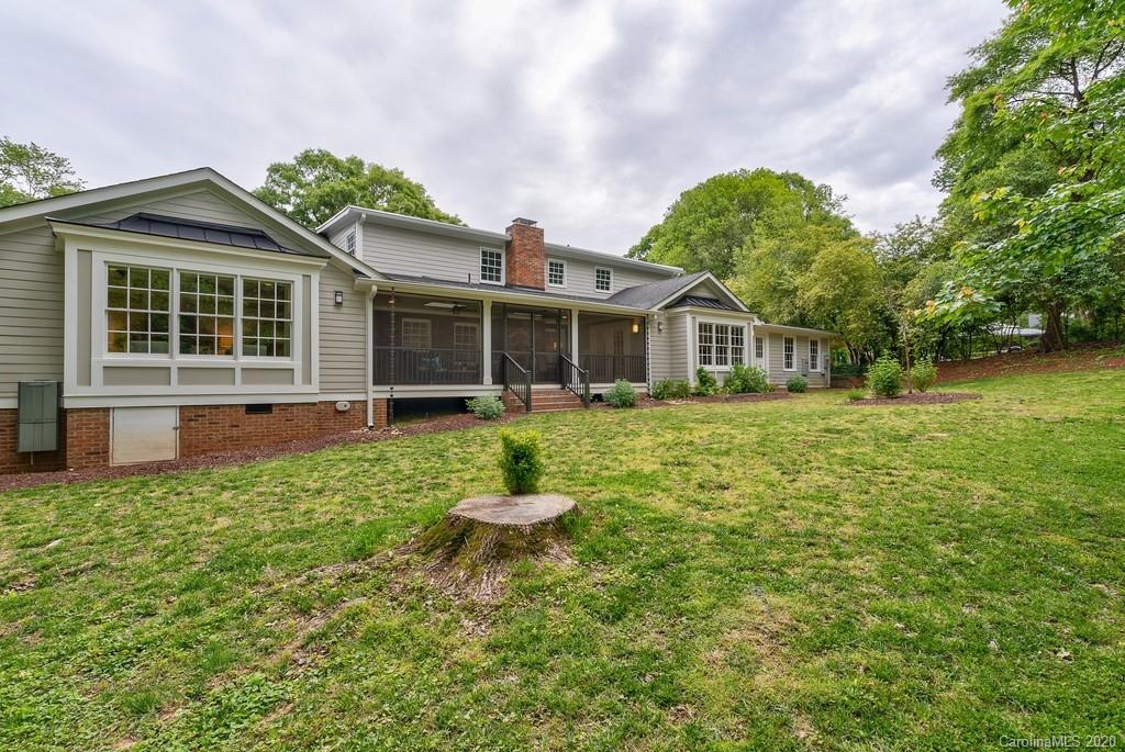 4200 Chelmsford Road Charlotte, NC 28211 - Photo 40 of 45 a front view of a house with a yard and trees