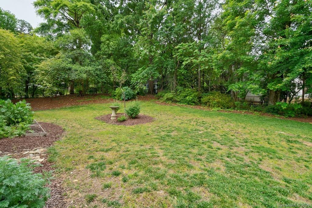4200 Chelmsford Road Charlotte, NC 28211 - Photo 44 of 45 a backyard of a house with lots of green space