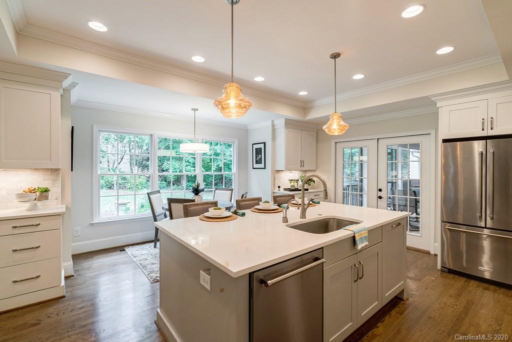 4200 Chelmsford Road Charlotte, NC 28211 - Photo 6 of 45 a open kitchen with stainless steel appliances granite countertop a sink a stove and a refrigerator