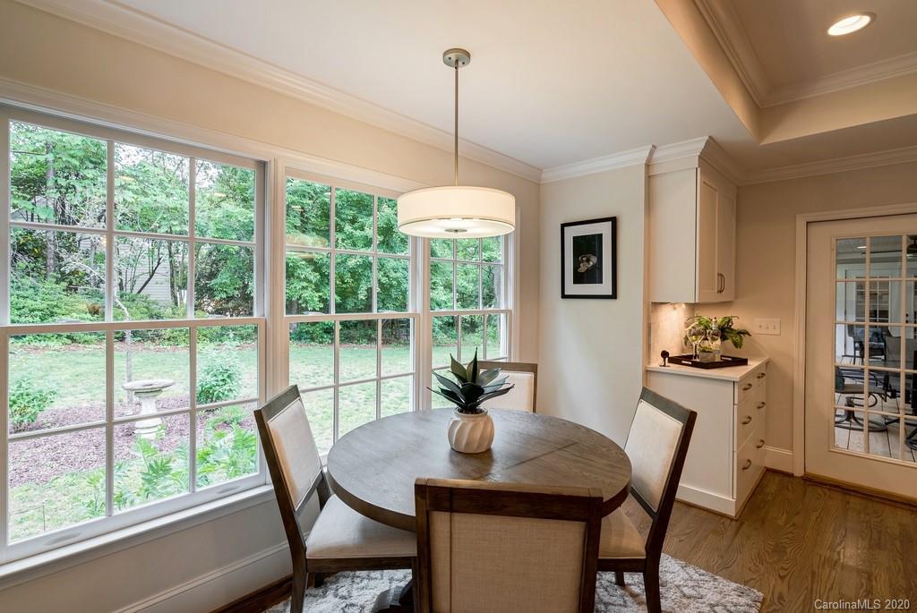 4200 Chelmsford Road Charlotte, NC 28211 - Photo 9 of 45 a view of a dining room with furniture window and wooden floor
