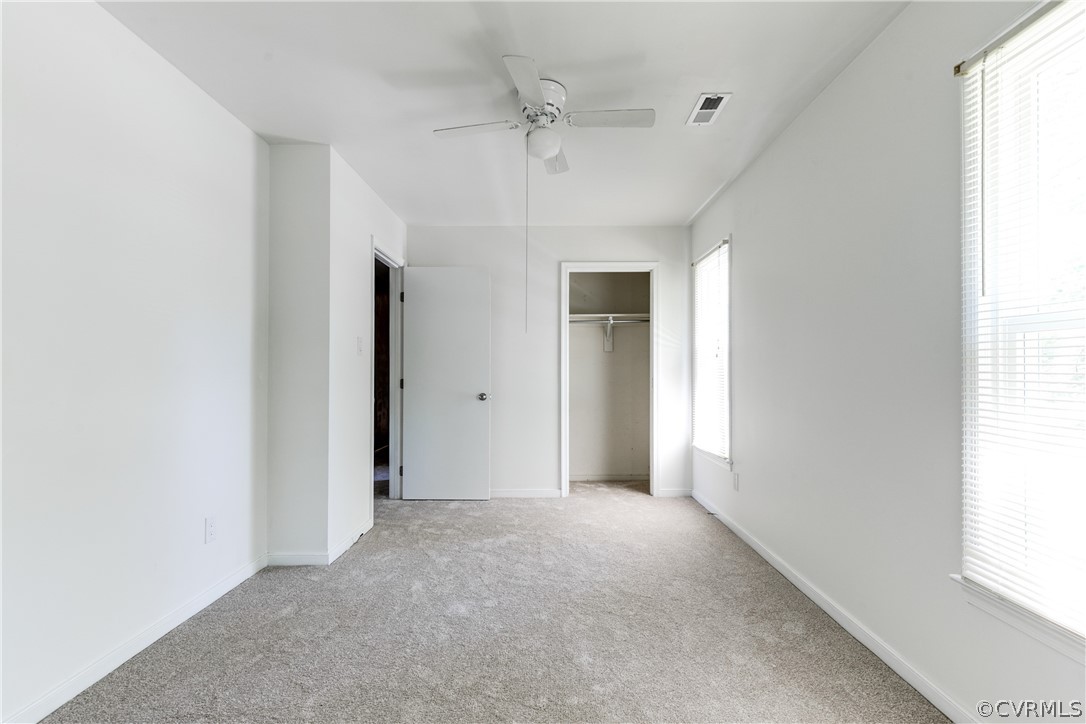6430 Jessup Road Chesterfield, VA 23832 - Photo 20 of 26 an empty room with a window and a hallway