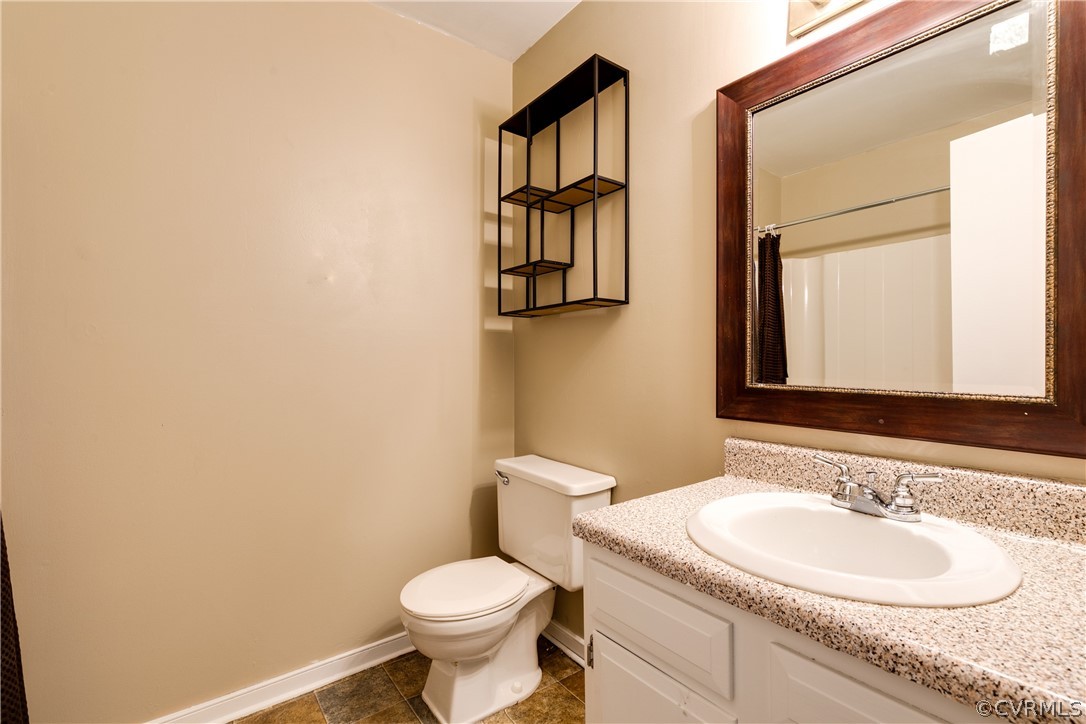 6430 Jessup Road Chesterfield, VA 23832 - Photo 21 of 26 a bathroom with a granite countertop sink and a mirror