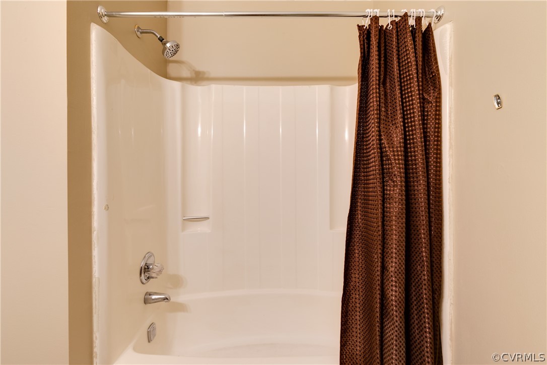 6430 Jessup Road Chesterfield, VA 23832 - Photo 22 of 26 a bathroom with a shower and a curtain