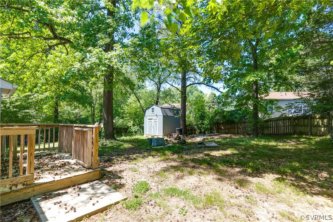 6430 Jessup Road Chesterfield, VA 23832 - Photo 23 of 26 a backyard of a house with table and chairs